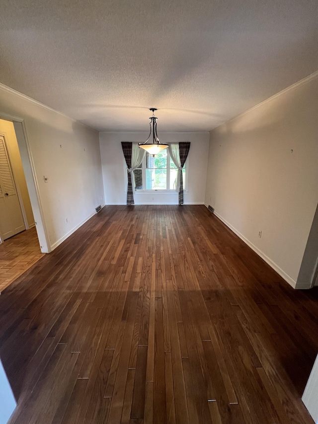 212 N 3rd St, Pulaski, TN 38478 - unfurnished dining area with dark wood finished floors, baseboards, and a textured ceiling