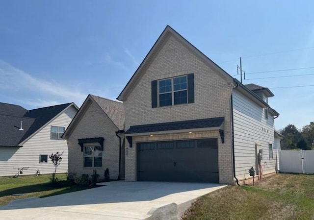 234 Glade Dr, Mount Juliet, TN 37122 - traditional home featuring a garage, brick siding, and driveway