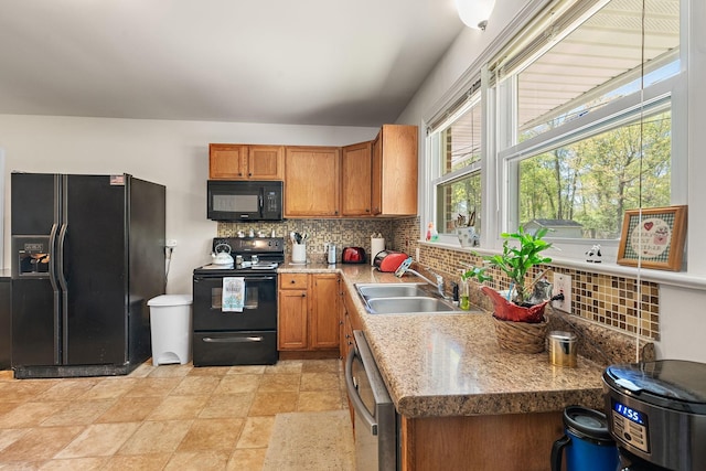 1618 Woodside Dr, Lebanon, TN 37087 - kitchen with black appliances, a sink, backsplash, and brown cabinets