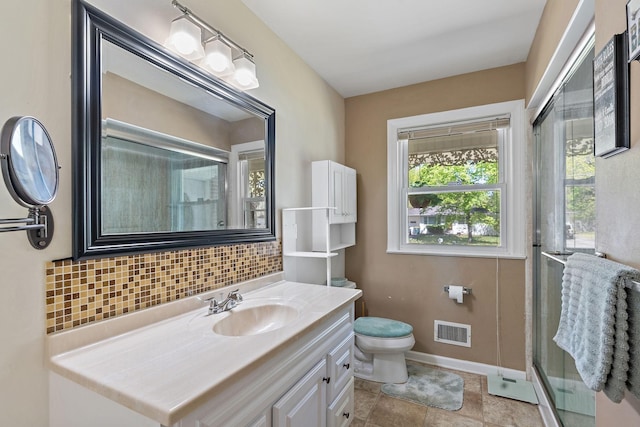 1618 Woodside Dr, Lebanon, TN 37087 - bathroom featuring vanity, decorative backsplash, toilet, an enclosed shower, and baseboards