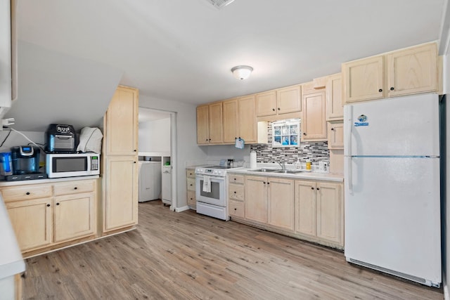 1618 Woodside Dr, Lebanon, TN 37087 - kitchen featuring white appliances, light brown cabinetry, washer / clothes dryer, a sink, and light wood-style flooring