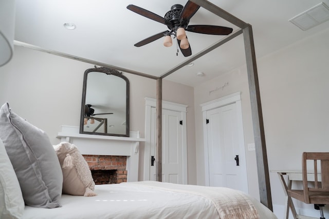205 College St, Portland, TN 37148 - bedroom with a fireplace and a ceiling fan