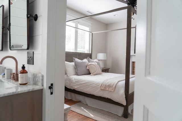 205 College St, Portland, TN 37148 - bedroom featuring wood finished floors and a sink