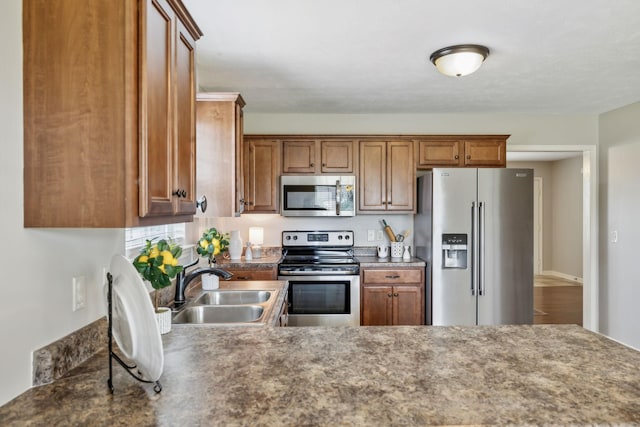 4219 Zephyr Ct, Murfreesboro, TN 37128 - kitchen featuring stainless steel appliances, a sink, and brown cabinets