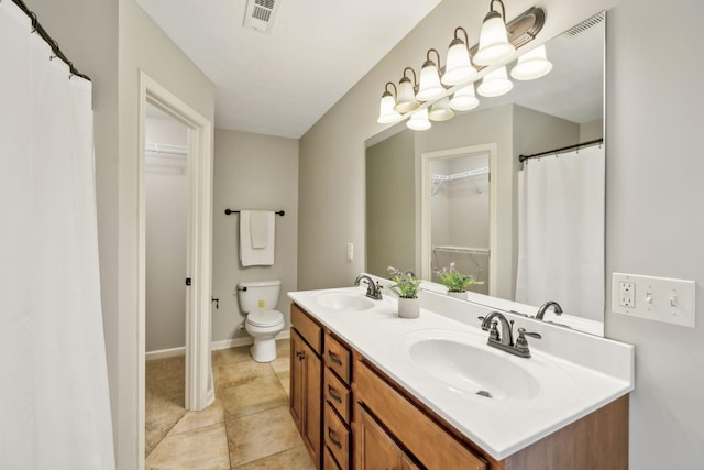 4219 Zephyr Ct, Murfreesboro, TN 37128 - full bath with double vanity, toilet, a walk in closet, and tile patterned flooring