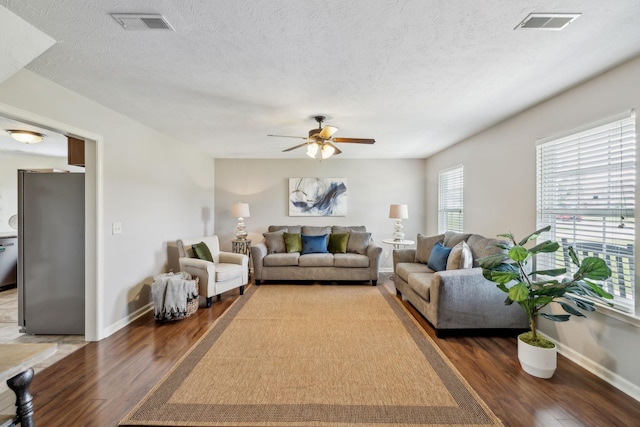 4219 Zephyr Ct, Murfreesboro, TN 37128 - living room with wood finished floors, baseboards, ceiling fan, and a textured ceiling