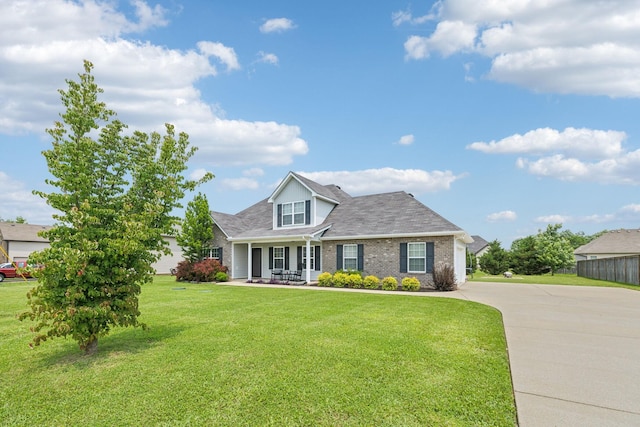 4219 Zephyr Ct, Murfreesboro, TN 37128 - view of front facade featuring driveway, a front yard, brick siding, roof with shingles, and a porch