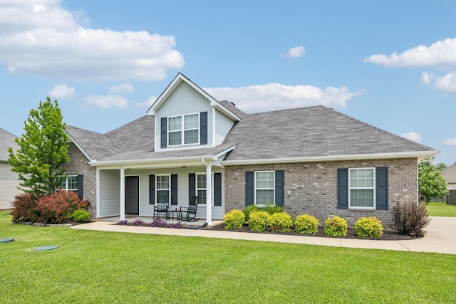 4219 Zephyr Ct, Murfreesboro, TN 37128 - view of front of property with covered porch, a front yard, brick siding, and a shingled roof