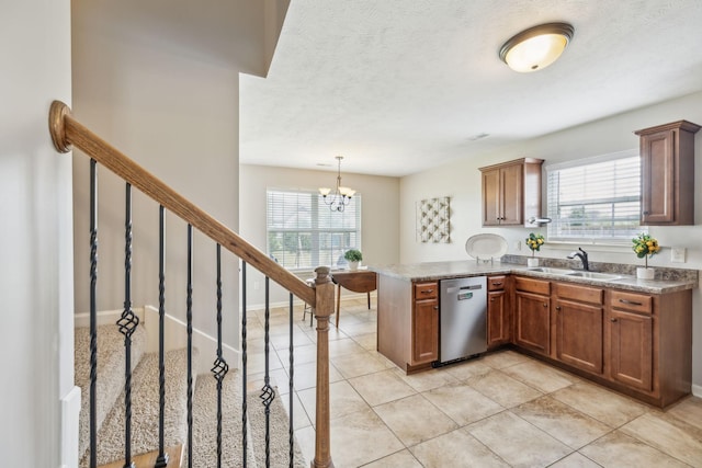 4219 Zephyr Ct, Murfreesboro, TN 37128 - kitchen featuring dishwasher, a sink, a peninsula, healthy amount of natural light, and a textured ceiling