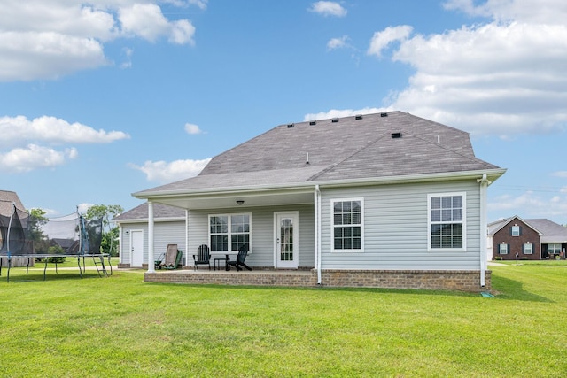 4219 Zephyr Ct, Murfreesboro, TN 37128 - back of property featuring a trampoline, a lawn, and a patio