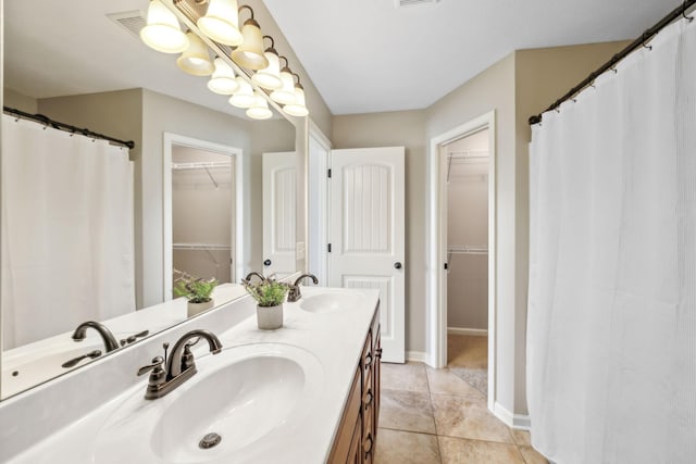 4219 Zephyr Ct, Murfreesboro, TN 37128 - full bathroom with a walk in closet, double vanity, tile patterned flooring, baseboards, and curtained shower
