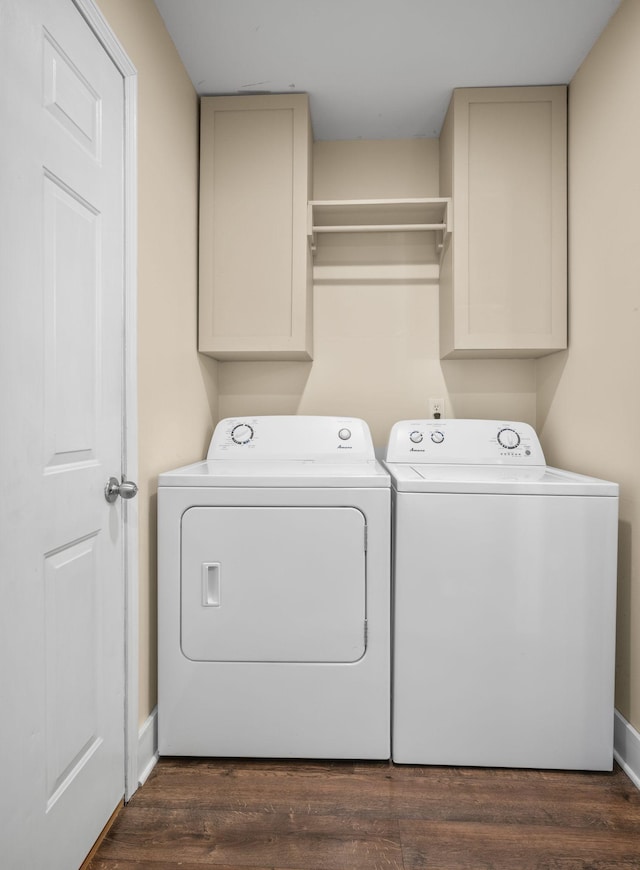 7116 Meadow View Dr, Fairview, TN 37062 - washroom featuring separate washer and dryer, cabinet space, and dark wood-style flooring