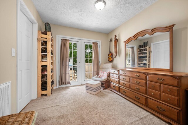 7116 Meadow View Dr, Fairview, TN 37062 - living area featuring french doors, carpet floors, and a textured ceiling