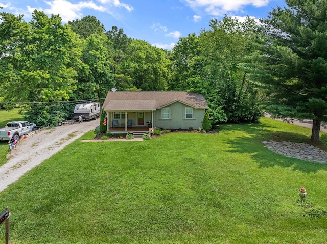 7116 Meadow View Dr, Fairview, TN 37062 - view of front of home featuring covered porch, driveway, a front lawn, and a wooded view