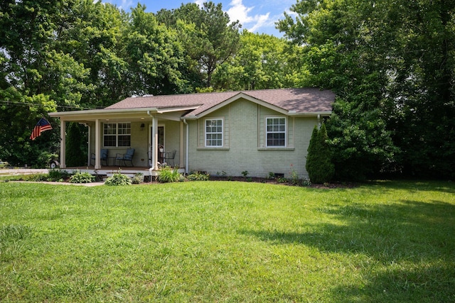 7116 Meadow View Dr, Fairview, TN 37062 - view of front of home with brick siding, covered porch, a front lawn, and roof with shingles