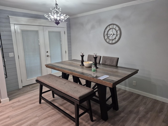 1140 Morriswood Dr, Joelton, TN 37080 - dining area with light wood-style floors, crown molding, baseboards, and a chandelier