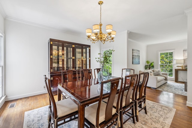 907 Paddock Park, Nashville, TN 37220 - dining room featuring ornamental molding, a chandelier, wood finished floors, and baseboards