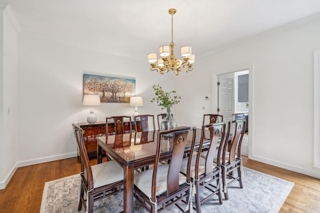 907 Paddock Park, Nashville, TN 37220 - dining space featuring a chandelier, ornamental molding, wood finished floors, and baseboards