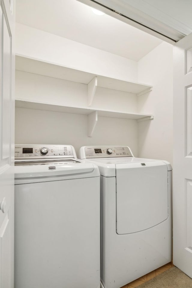 907 Paddock Park, Nashville, TN 37220 - laundry area featuring washer and dryer and tile patterned flooring