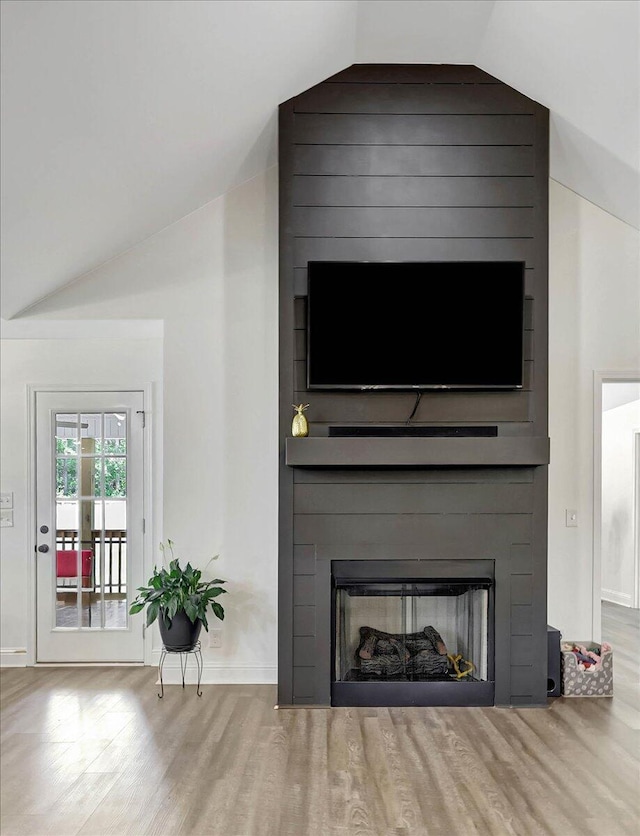3128 Crow Rd NE, Dalton, GA 30721 - detailed view of a large fireplace, wood finished floors, and baseboards
