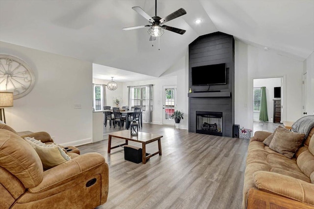 3128 Crow Rd NE, Dalton, GA 30721 - living room featuring high vaulted ceiling, a ceiling fan, light wood-type flooring, baseboards, and a fireplace