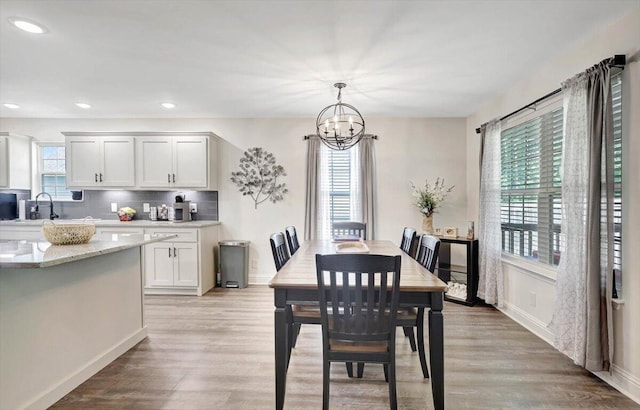 3128 Crow Rd NE, Dalton, GA 30721 - dining area featuring a chandelier, light wood finished floors, recessed lighting, and baseboards