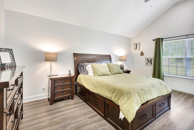 3128 Crow Rd NE, Dalton, GA 30721 - bedroom featuring light wood-style floors, baseboards, a ceiling fan, and high vaulted ceiling