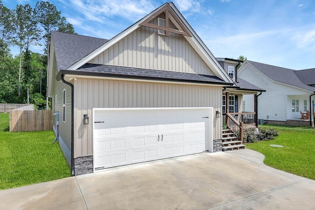 3128 Crow Rd NE, Dalton, GA 30721 - view of front facade featuring a shingled roof, an attached garage, board and batten siding, and concrete driveway