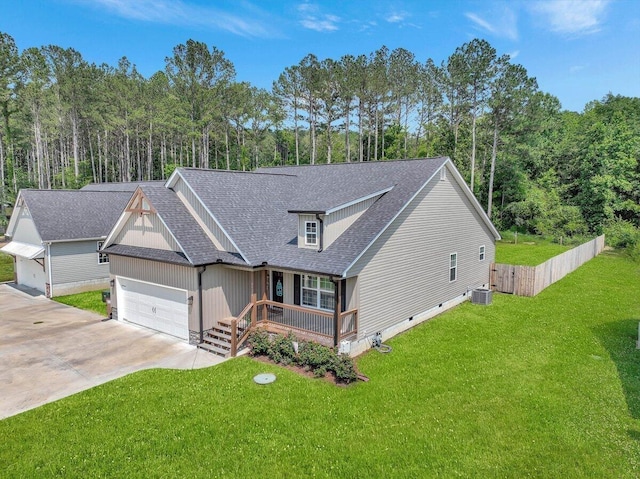 3128 Crow Rd NE, Dalton, GA 30721 - view of front of house with covered porch, cooling unit, an attached garage, driveway, and roof with shingles