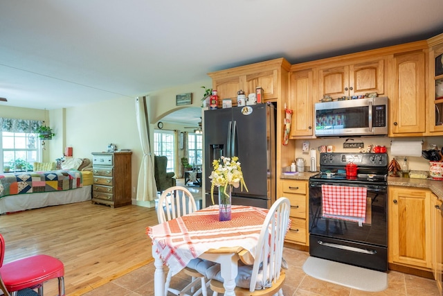 222 Bennie Camp Rd, Dunlap, TN 37327 - kitchen with stainless steel appliances, arched walkways, and open floor plan