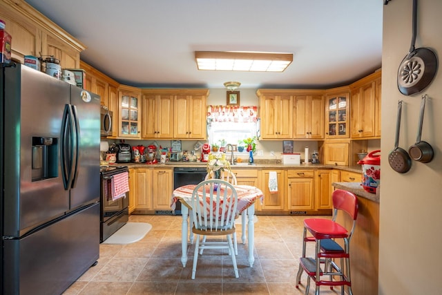 222 Bennie Camp Rd, Dunlap, TN 37327 - kitchen with appliances with stainless steel finishes, glass insert cabinets, a sink, and light tile patterned flooring
