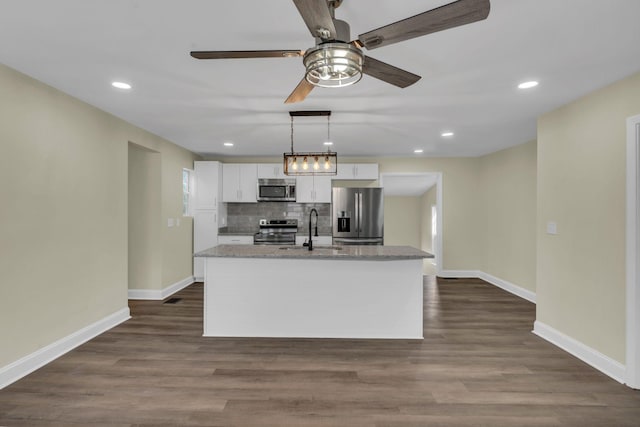 806 Drummond Dr, Nashville, TN 37211 - kitchen with stainless steel appliances, a sink, white cabinets, baseboards, and recessed lighting