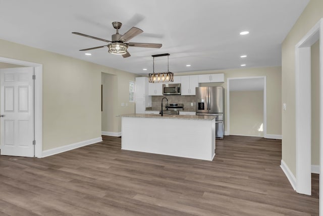 806 Drummond Dr, Nashville, TN 37211 - kitchen featuring stainless steel appliances, white cabinets, a sink, an island with sink, and ceiling fan