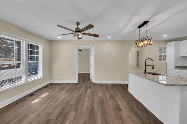 806 Drummond Dr, Nashville, TN 37211 - kitchen with a sink, white cabinetry, recessed lighting, light stone counters, and dark wood-type flooring
