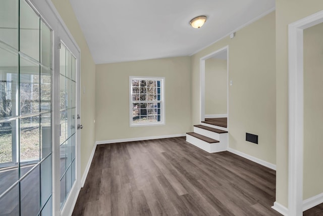 806 Drummond Dr, Nashville, TN 37211 - spare room featuring dark wood-style flooring, baseboards, stairway, and lofted ceiling