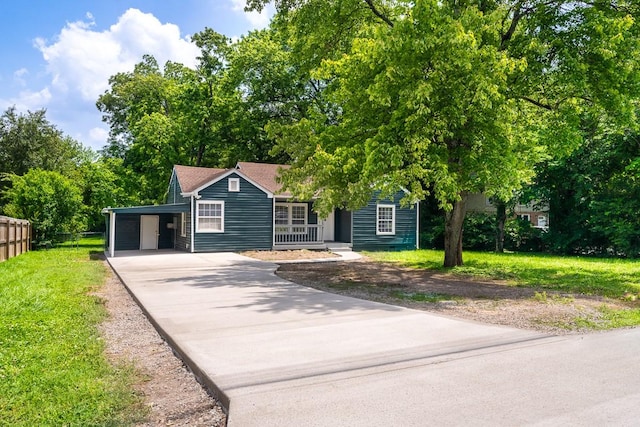 806 Drummond Dr, Nashville, TN 37211 - view of property hidden behind natural elements with driveway, an attached carport, and a porch