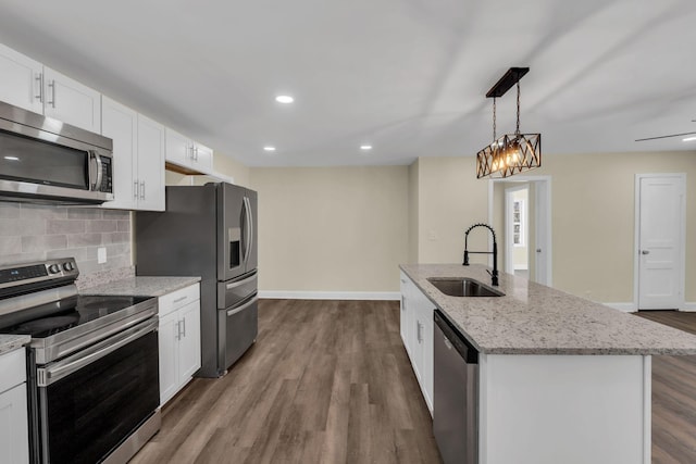 806 Drummond Dr, Nashville, TN 37211 - kitchen with appliances with stainless steel finishes, a sink, dark wood-style flooring, decorative backsplash, and white cabinets
