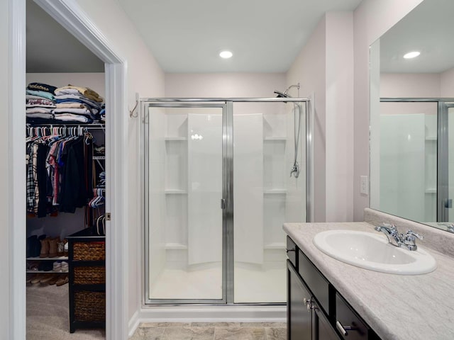 7231 Carrie Ct, Antioch, TN 37013 - full bathroom with a shower stall, vanity, a walk in closet, and recessed lighting