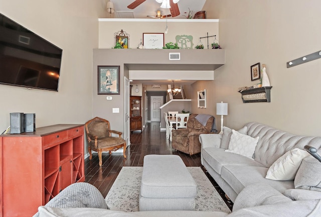 1071 Muna Ct, Spring Hill, TN 37174 - living room featuring dark wood finished floors, a ceiling fan, a chandelier, and baseboards
