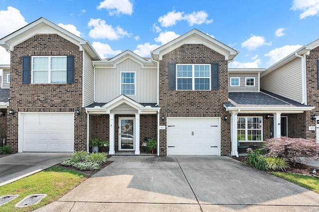 1071 Muna Ct, Spring Hill, TN 37174 - view of front of property featuring concrete driveway, brick siding, and a garage