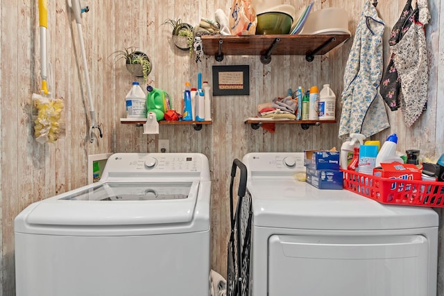 1071 Muna Ct, Spring Hill, TN 37174 - washroom with washing machine and dryer and wood walls