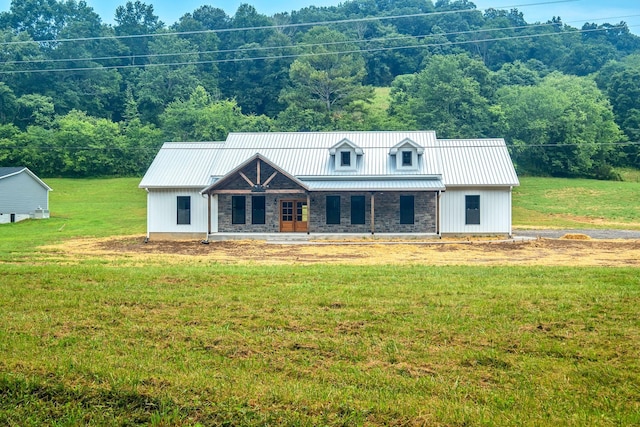 53 Kemp Hollow Rd, Pleasant Shade, TN 37145 - view of front of property featuring a front lawn, a metal roof, and covered porch