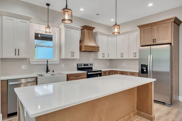 53 Kemp Hollow Rd, Pleasant Shade, TN 37145 - kitchen with appliances with stainless steel finishes, custom exhaust hood, light countertops, light wood-style floors, and recessed lighting