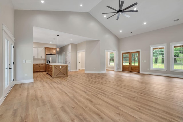 53 Kemp Hollow Rd, Pleasant Shade, TN 37145 - unfurnished living room featuring high vaulted ceiling, light wood-style flooring, ceiling fan, and recessed lighting