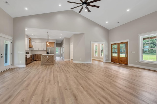53 Kemp Hollow Rd, Pleasant Shade, TN 37145 - unfurnished living room featuring high vaulted ceiling, a ceiling fan, light wood-style flooring, recessed lighting, and french doors