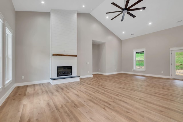 53 Kemp Hollow Rd, Pleasant Shade, TN 37145 - unfurnished living room with ceiling fan, high vaulted ceiling, a large fireplace, light wood-style floors, and recessed lighting