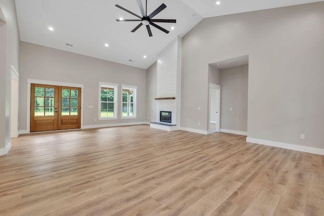 53 Kemp Hollow Rd, Pleasant Shade, TN 37145 - unfurnished living room featuring high vaulted ceiling, a large fireplace, light wood finished floors, recessed lighting, and ceiling fan