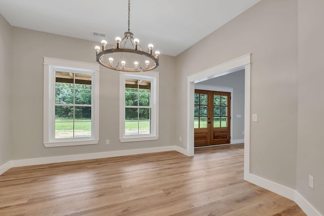 53 Kemp Hollow Rd, Pleasant Shade, TN 37145 - empty room with a chandelier, french doors, healthy amount of natural light, and light wood-style floors