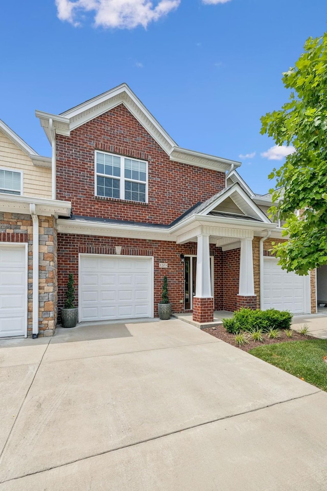 2342 N Tennessee Blvd Unit 1203, Murfreesboro, TN 37130 - view of front facade featuring driveway, brick siding, and covered porch