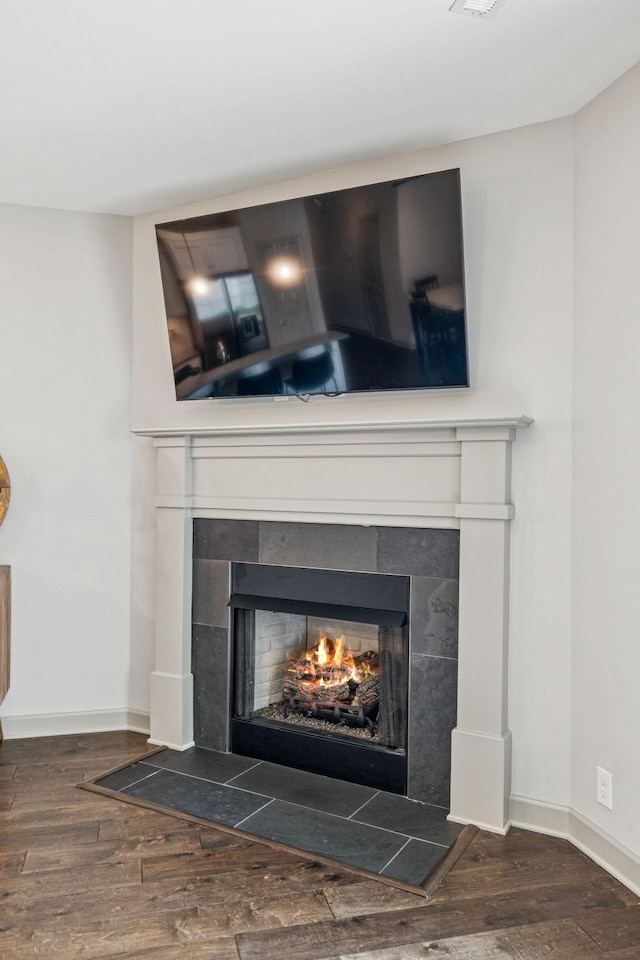 2342 N Tennessee Blvd Unit 1203, Murfreesboro, TN 37130 - detailed view of a tile fireplace, wood finished floors, and baseboards